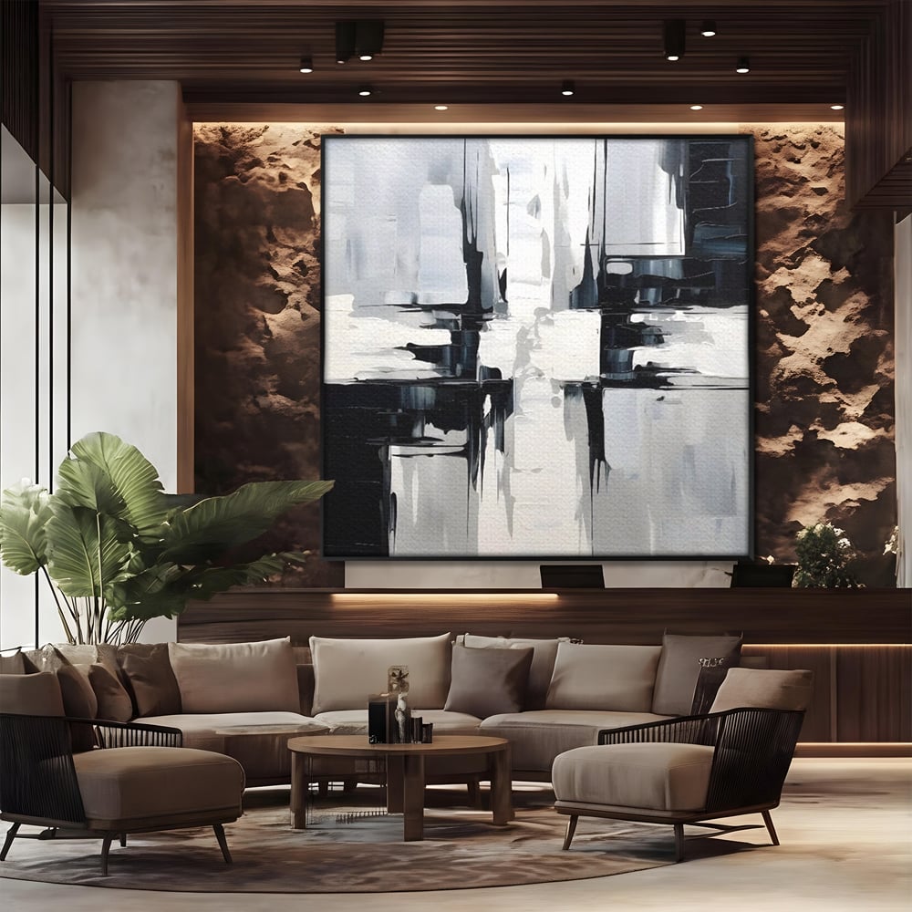 Tablou canvas cu pictura abstracta alb-negru, in rama de aluminiu negru, pe perete intr-un birou